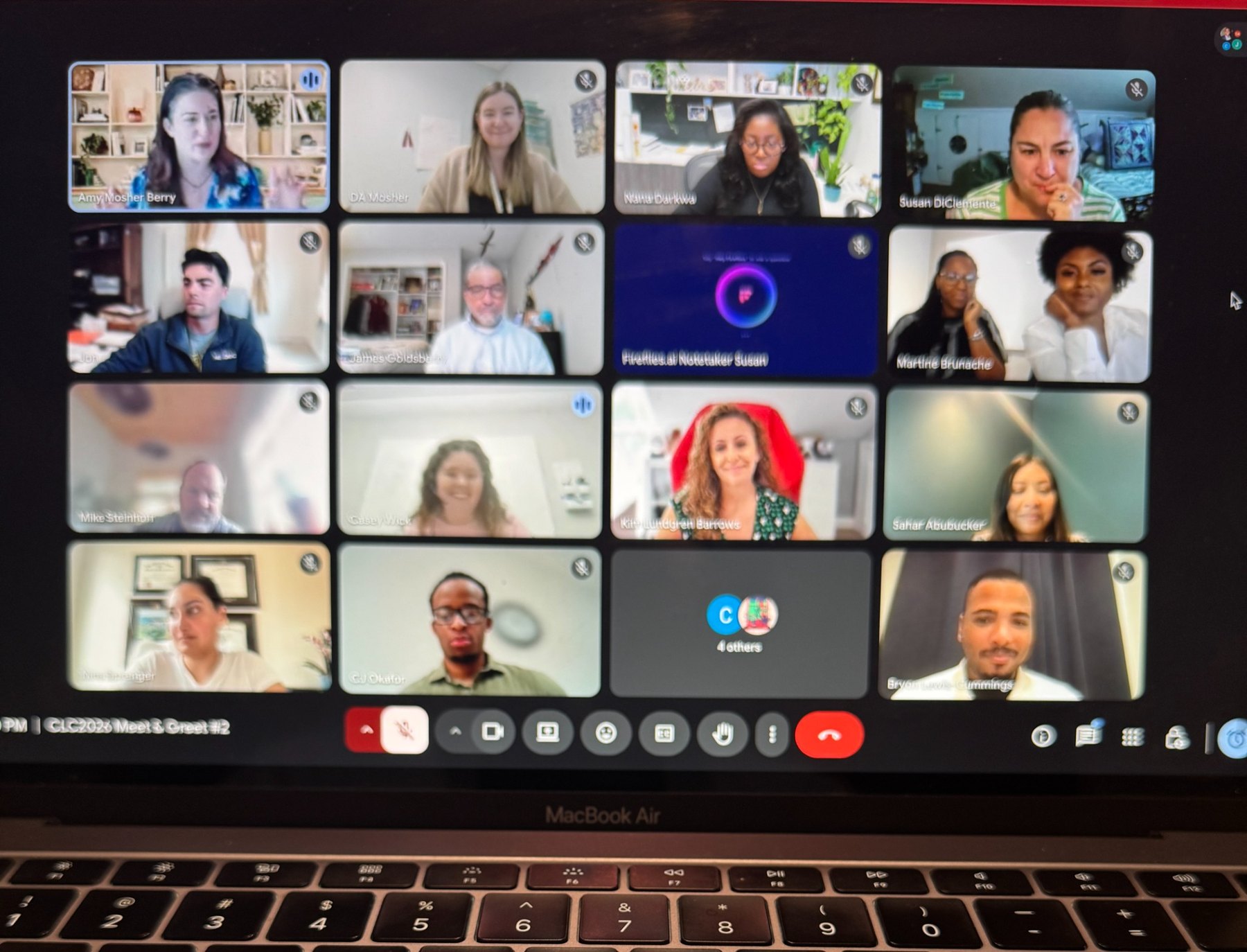 Conference planning meeting on a laptop