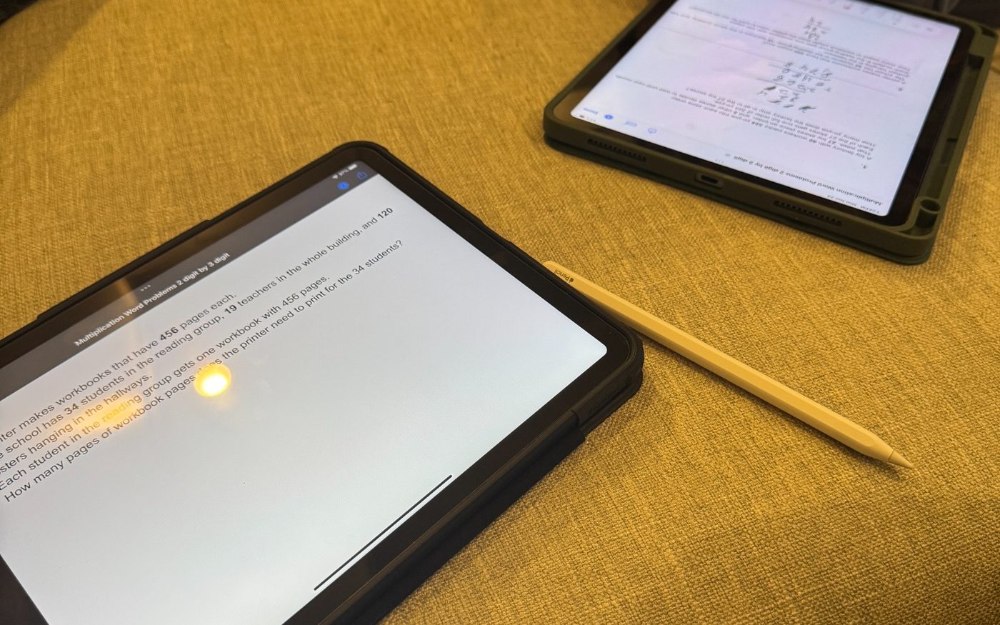 Two iPads used for a word problem and written work
