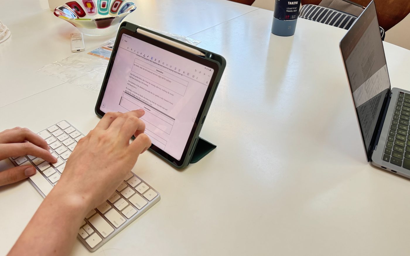 Student touching an iPad screen during a lesson